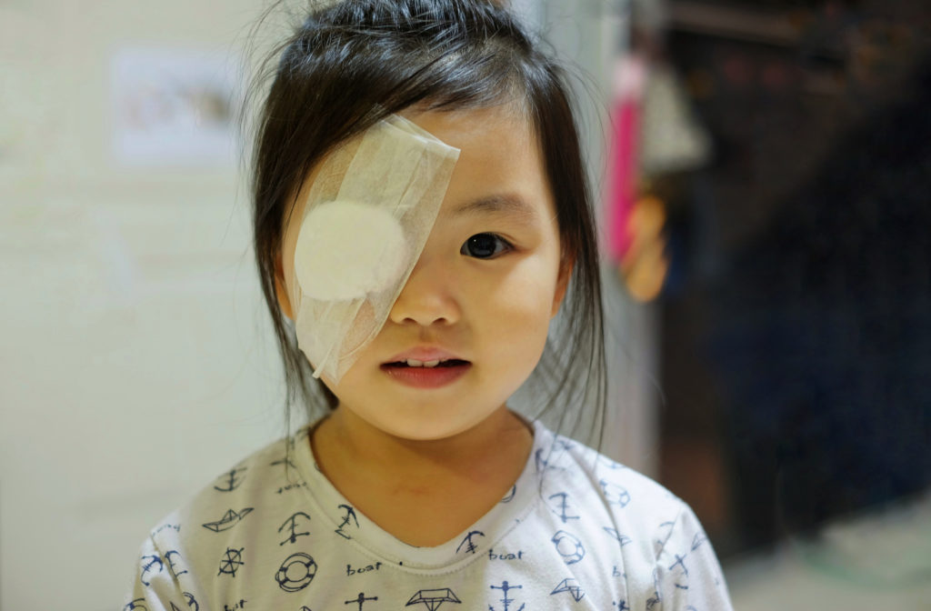 Young girls right eye covered with eye patch after an eye emergency.