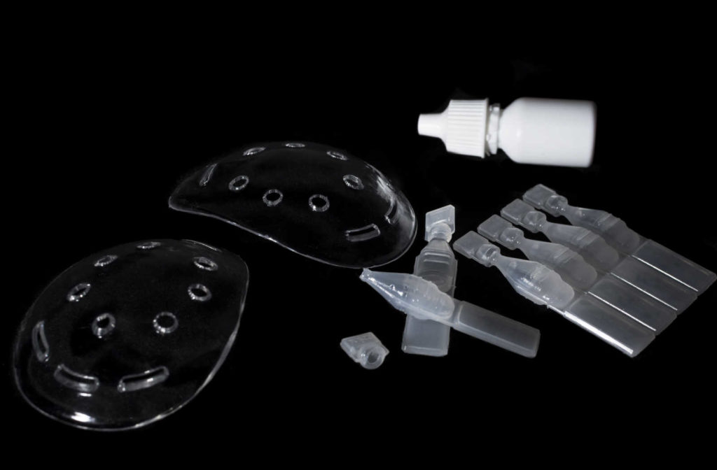Two clear plastic eye covers and eye drops were used after a LASIK eye surgery.