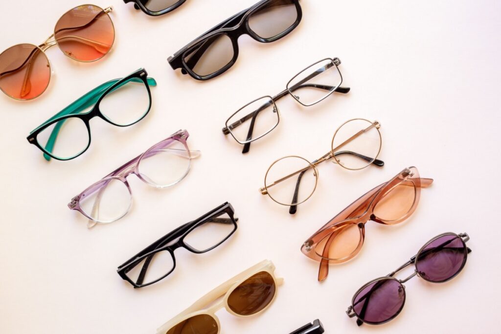 Several fashionable glasses frames arranged in two rows.